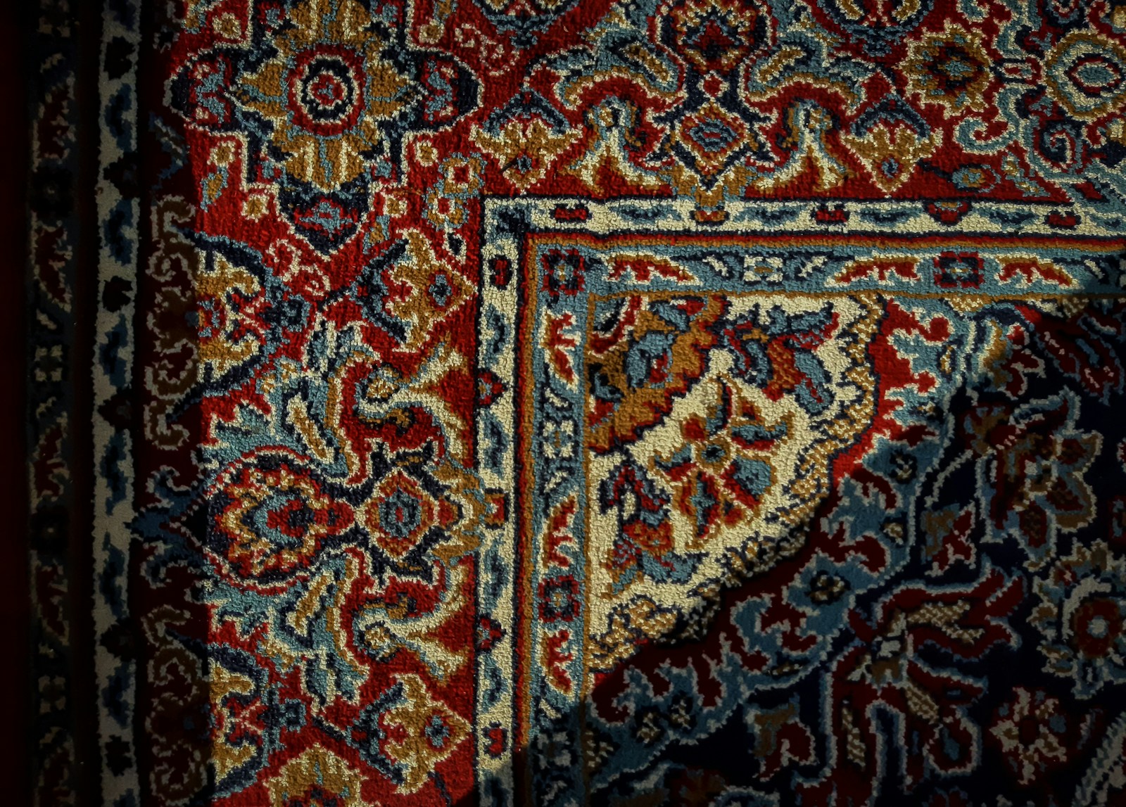 a carpet with a red and blue design on it
